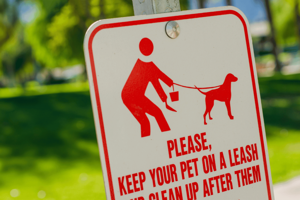 Clean Up After Pet Sign. Please Keep Your Pet on Leash and Clean Up After Them. Park Sign.