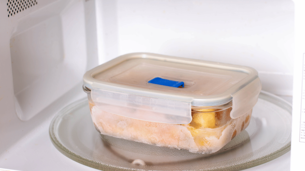 Frozen food in containers in the microwave