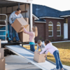 Family moving house, unloading truck