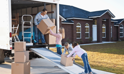 Family moving house, unloading truck