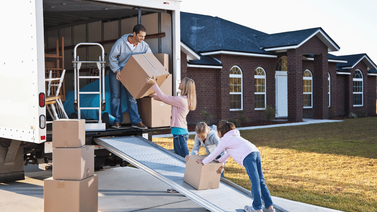 Family moving house, unloading truck