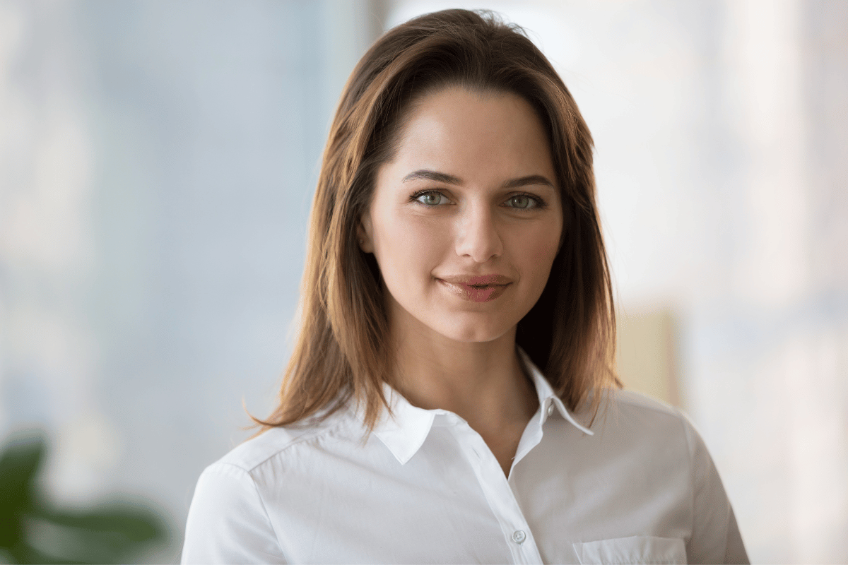 Confident smiling businesswoman looking at camera, young professional headshot portrait