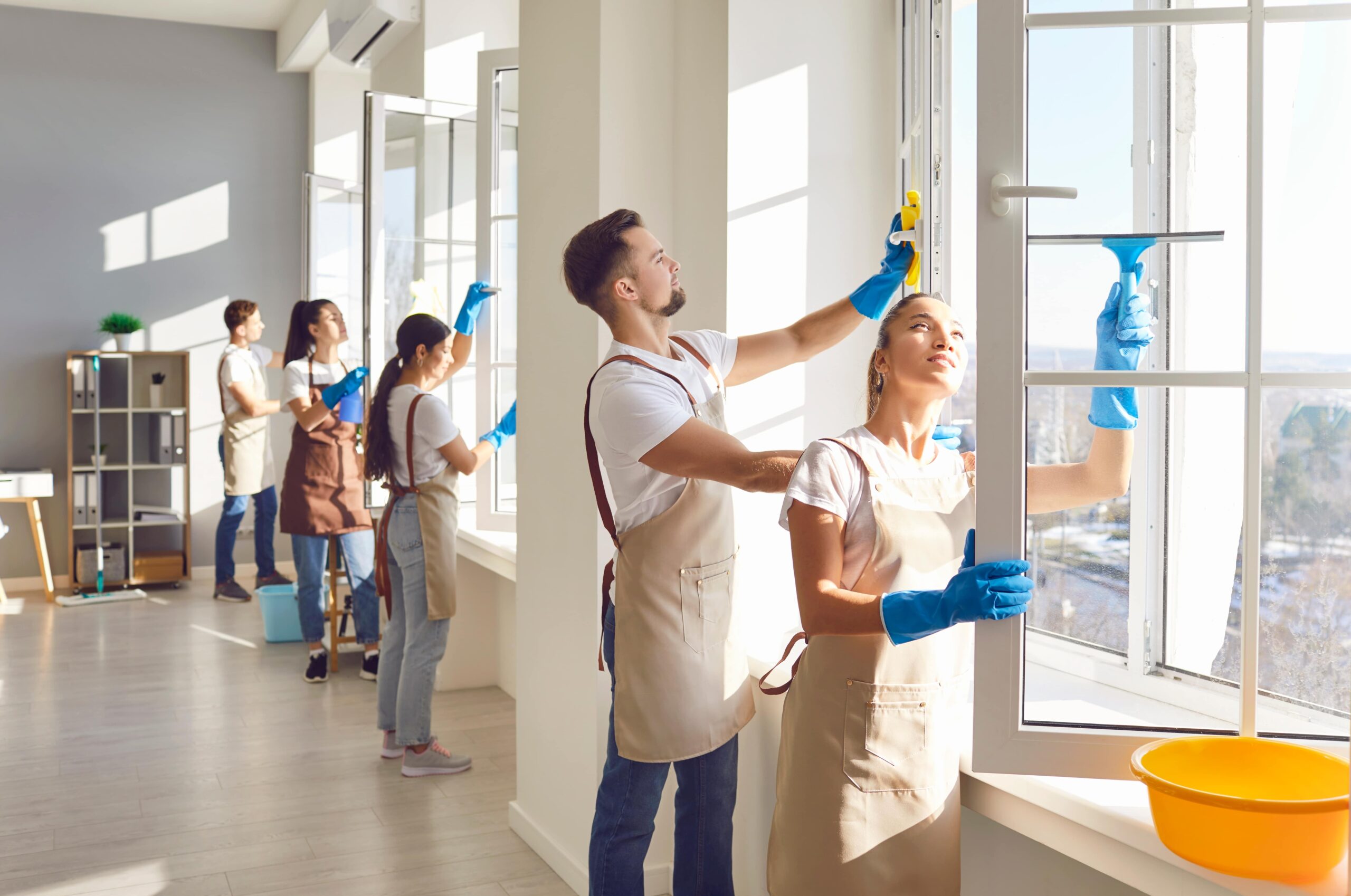 Window cleaners working on a high-rise building in Melbourne, representing one of the best businesses to start in Melbourne with minimal investment.
