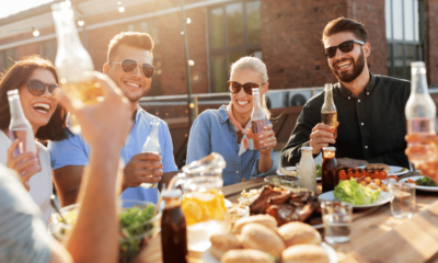 Happy Friends with Drinks or Bbq Party on Rooftop