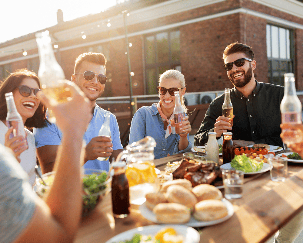 Happy Friends with Drinks or Bbq Party on Rooftop