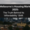 A panoramic view of Melbourne’s skyline in 2025 showing modern skyscrapers and historic rooftops under an overcast sky, representing the city’s changing housing market and affordability trends.