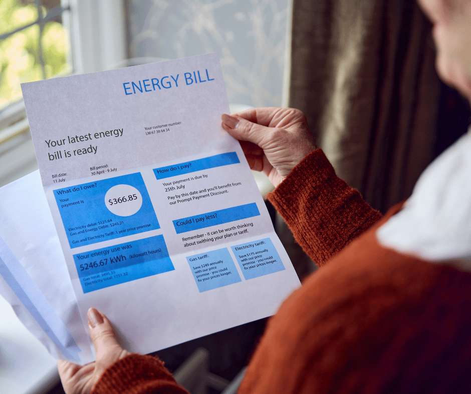 Close up of Senior Woman Opening Energy Bill Concerned about Cost of Living Energy Crisis