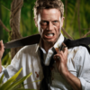 Determined man in business attire holding a machete in the jungle, symbolising Victoria’s tough response to rising violence under the machete ban.
