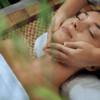 Client receiving a professional face massage in a serene spa setting