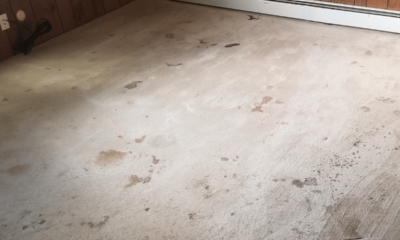 Heavily stained carpet showing visible wear and discolouration before professional cleaning