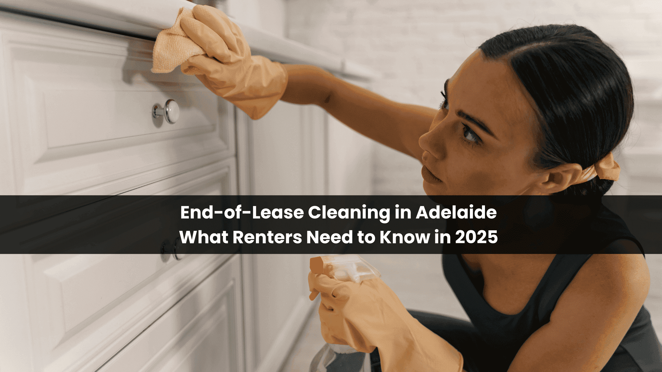 Woman cleaning kitchen cabinets during end of lease cleaning in Adelaide