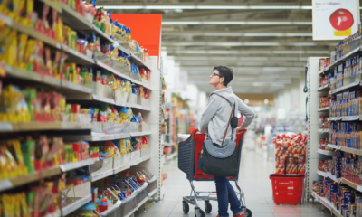 Australian shopper in a supermarket aisle as grocery prices continue to rise