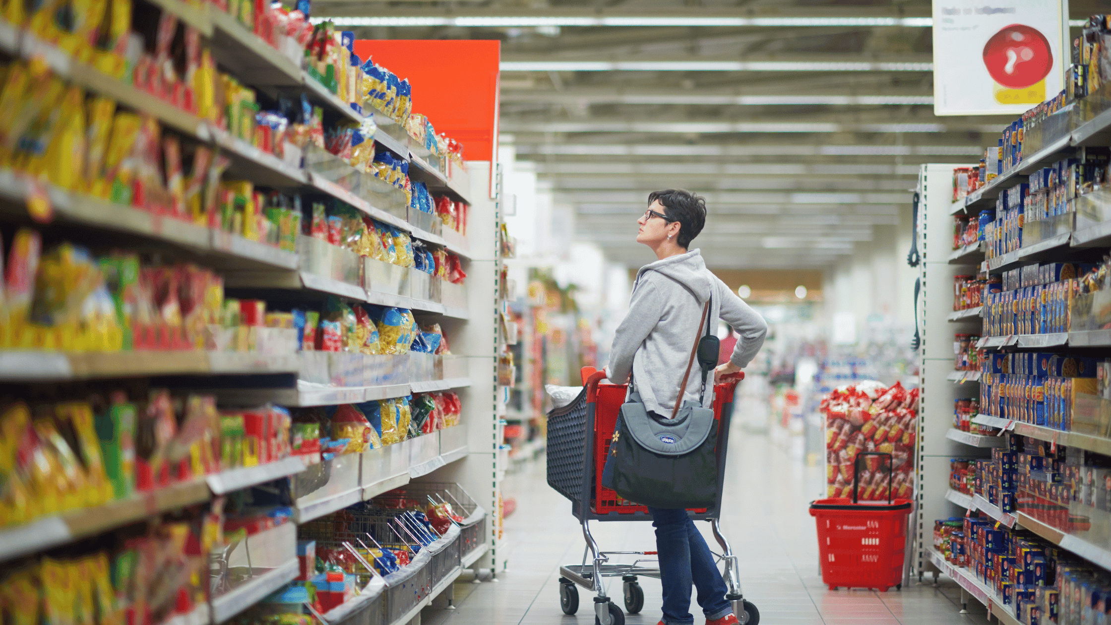 Australian shopper in a supermarket aisle as grocery prices continue to rise