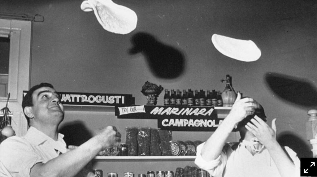 Salvatore Della Bruna and Franco Fera tossing pizza dough inside Toto’s Pizza House in Carlton, Melbourne, 1961