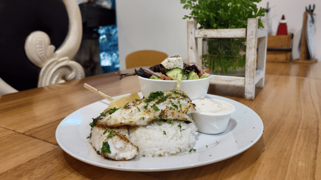 Pan-fried flathead with rice and salad at The Fresh Fish Place in Port Lincoln.